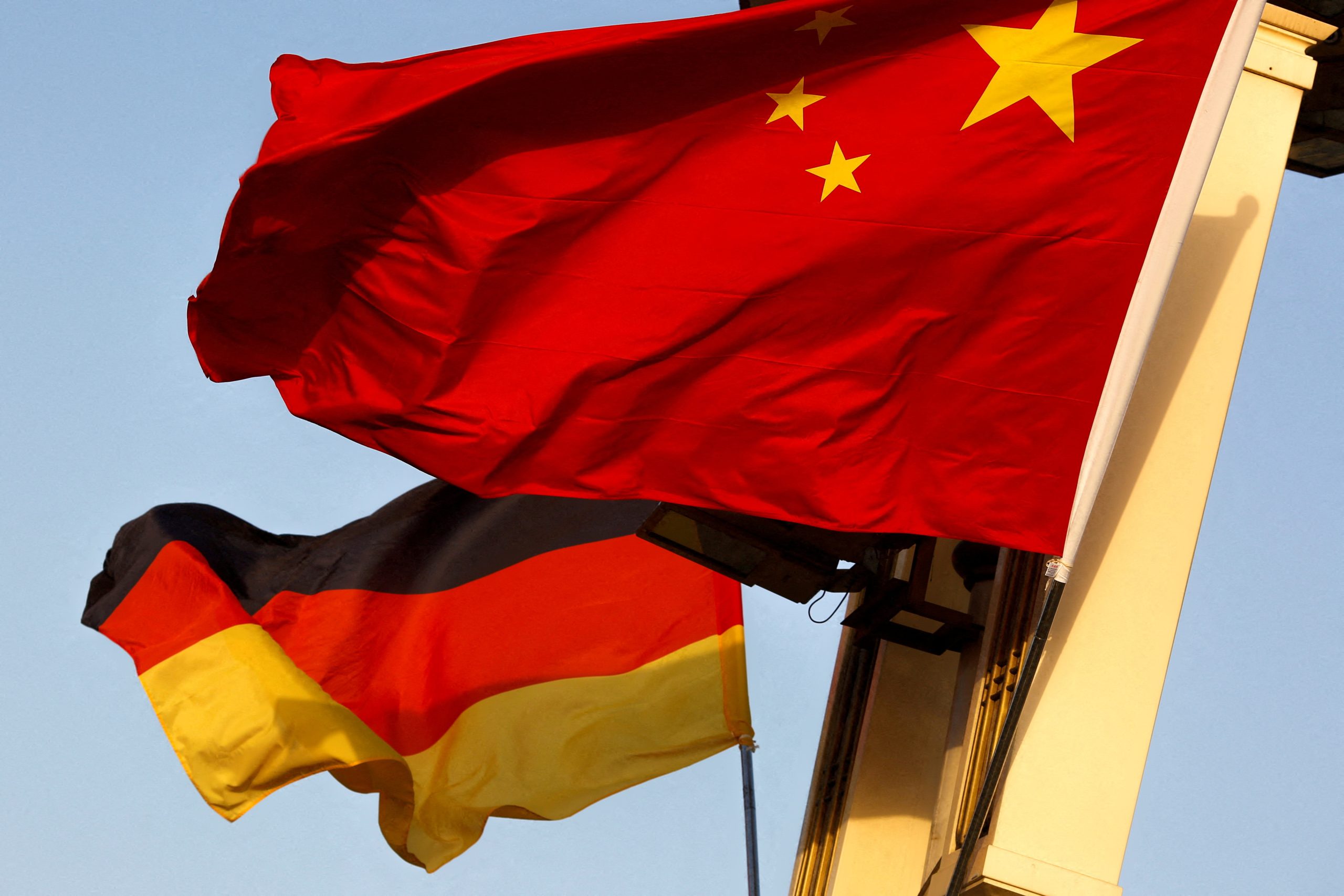 FILE PHOTO: FILE PHOTO: German and Chinese national flags fly in Tiananmen Square in Beijing
